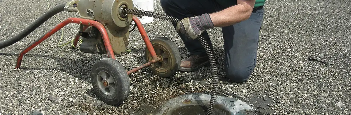 sewer rodding technician actively removing blockages from a sewer line in Memphis, TN