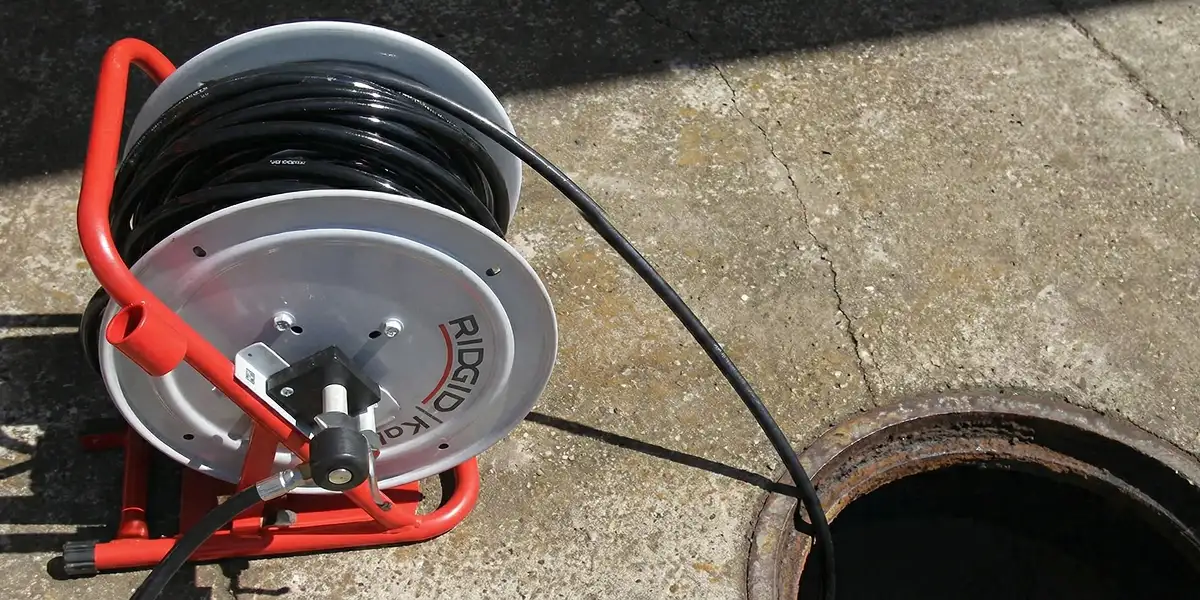 sewer rodding equipment prepared to clear clogged sewer lines in Memphis, TN