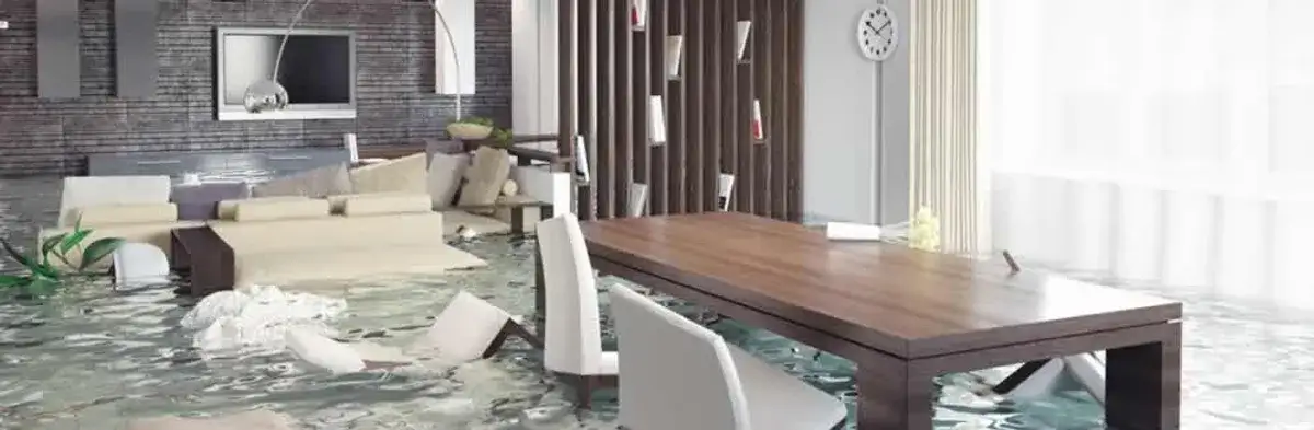 home interior affected by water damage with flooded floors and displaced furniture in Memphis, TN